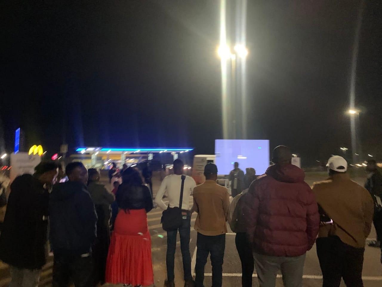 Audience at an outdoor evening screening