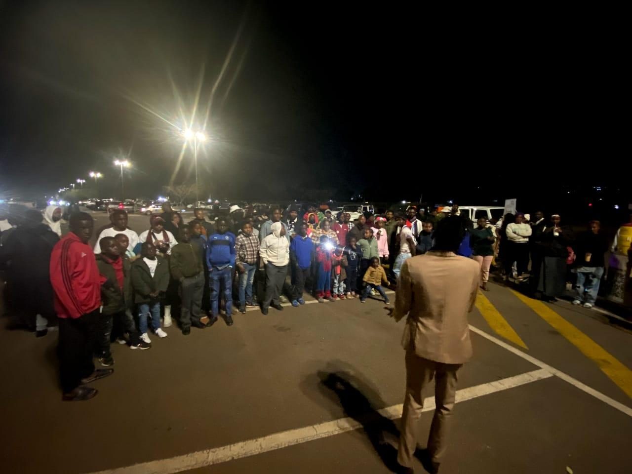 Audience gathered for an outdoor screening